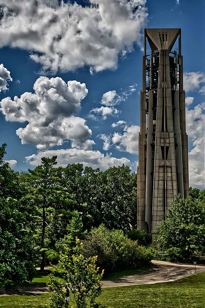things to do in naperville il Moser Tower with blue sky and clouds in background
