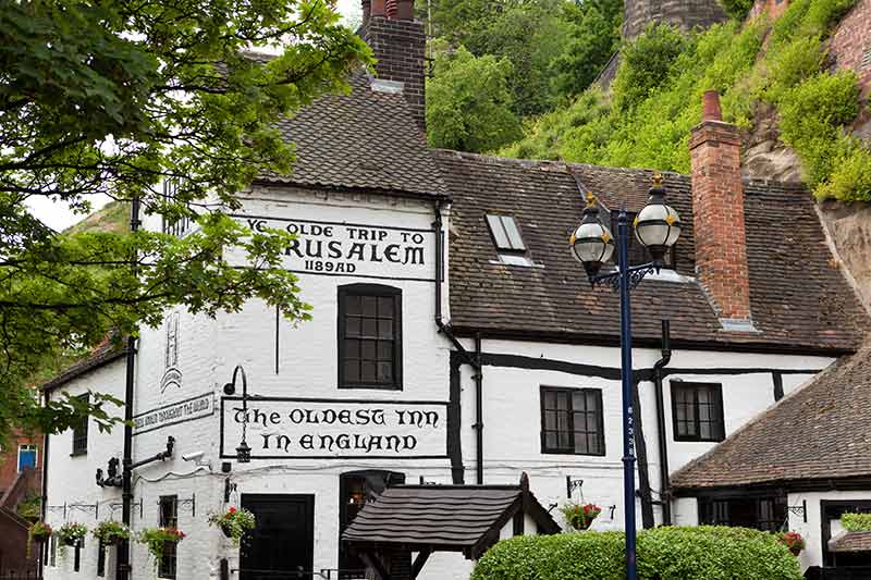 things to do in nottingham for adults white tudor pub building with sign 'the oldest inn in England'