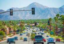 Cars driving along Palm Springs Highway towards the mountains
