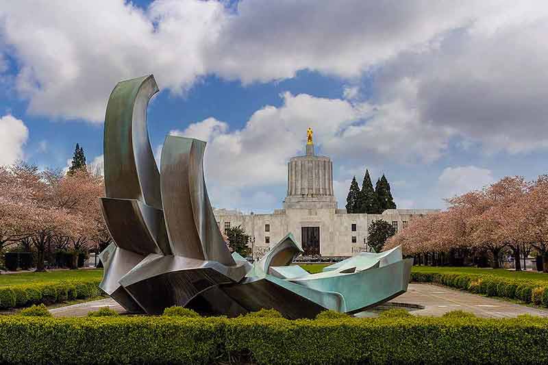 things to do in salem state of oregon capitol building with sculpture in the foreground