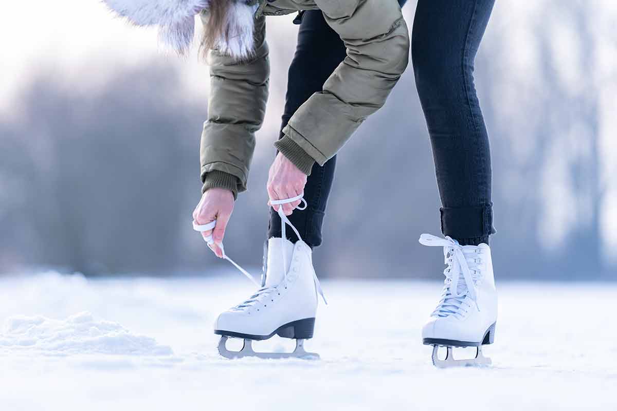 things to do in scranton Tying the laces of winter skates on a frozen lake.