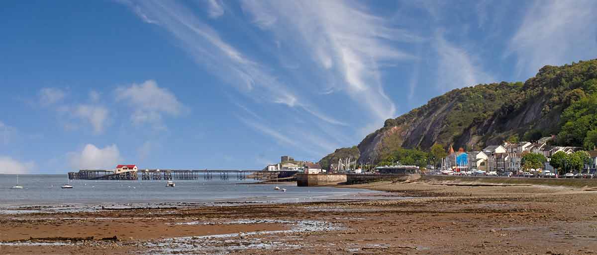 things to do in swansea with kids The Mumbles pier acros the beach