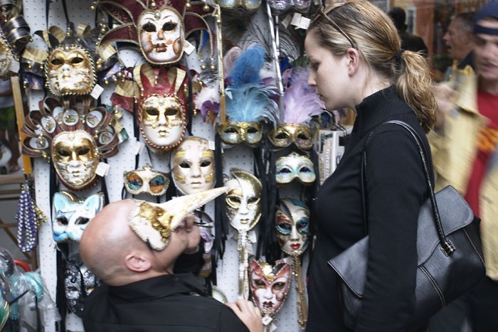 A man proposing in a mask in Venice