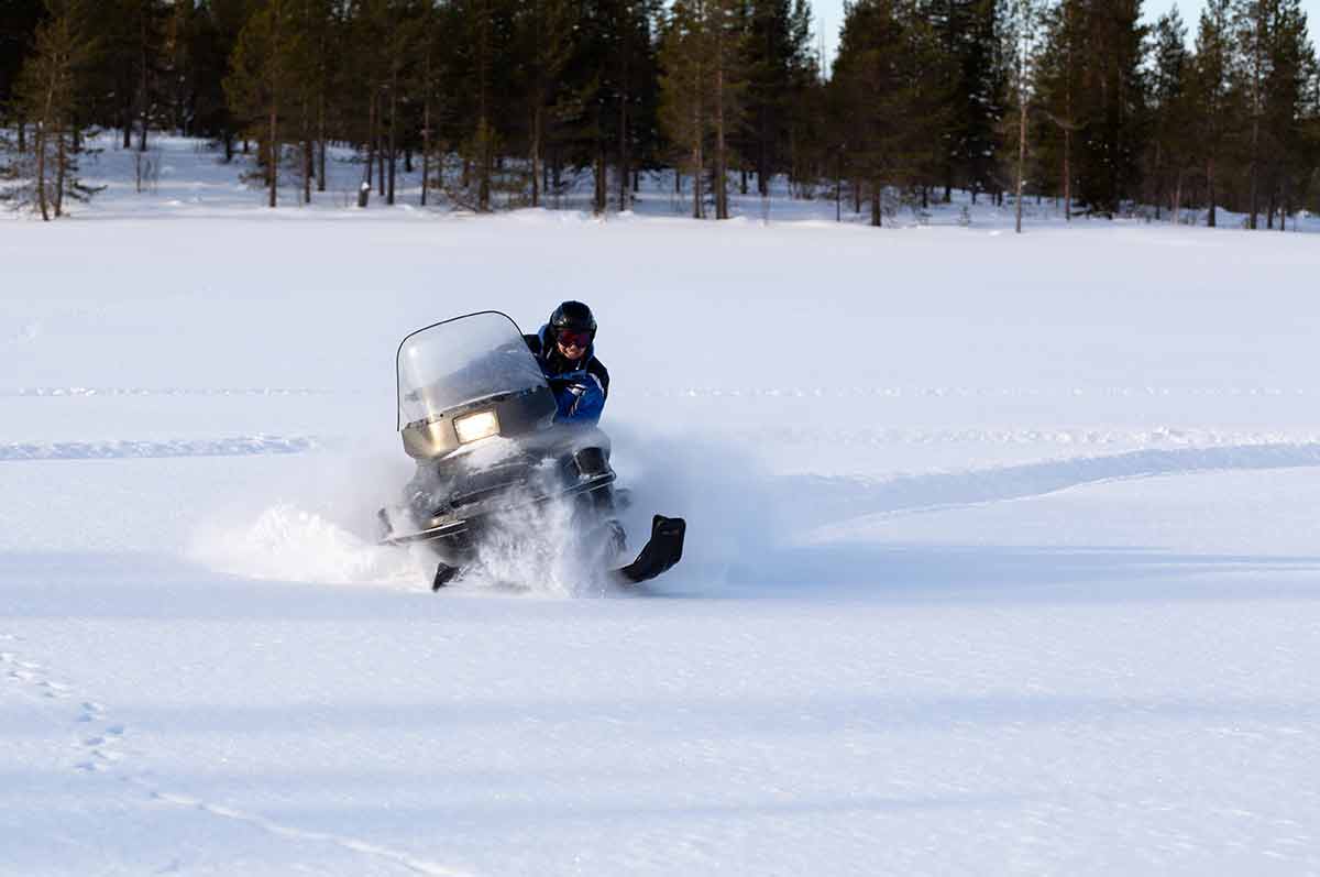Man Riding A Snowmobile