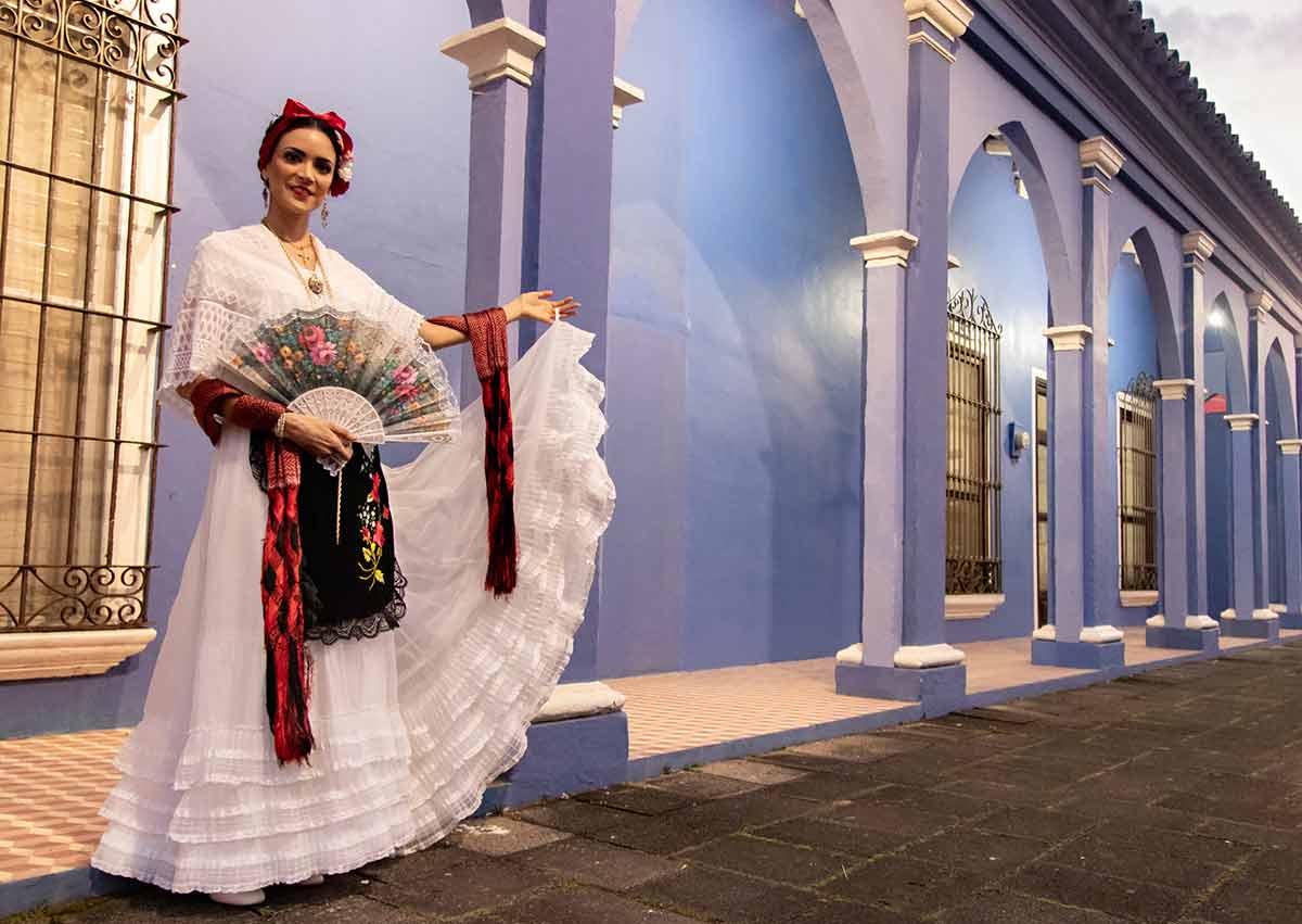 things to go veracruz jarocho in white dress holding a fan