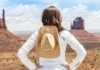 20 Things To Do In Monument Valley That Feel Unreal things to see and do in monument valley young woman wearing straw hat in Monument Valley.