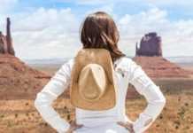 20 Things To Do In Monument Valley That Feel Unreal things to see and do in monument valley young woman wearing straw hat in Monument Valley.