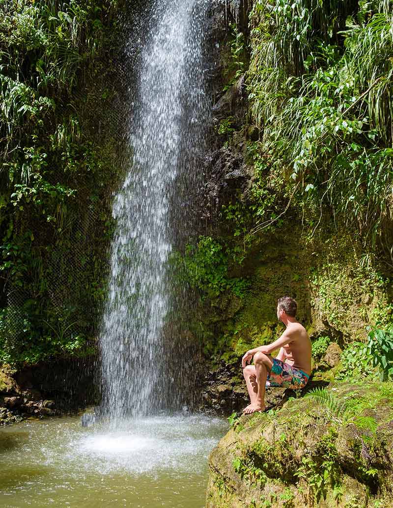 Saint Lucia Jungle Waterfall And Men Swimming