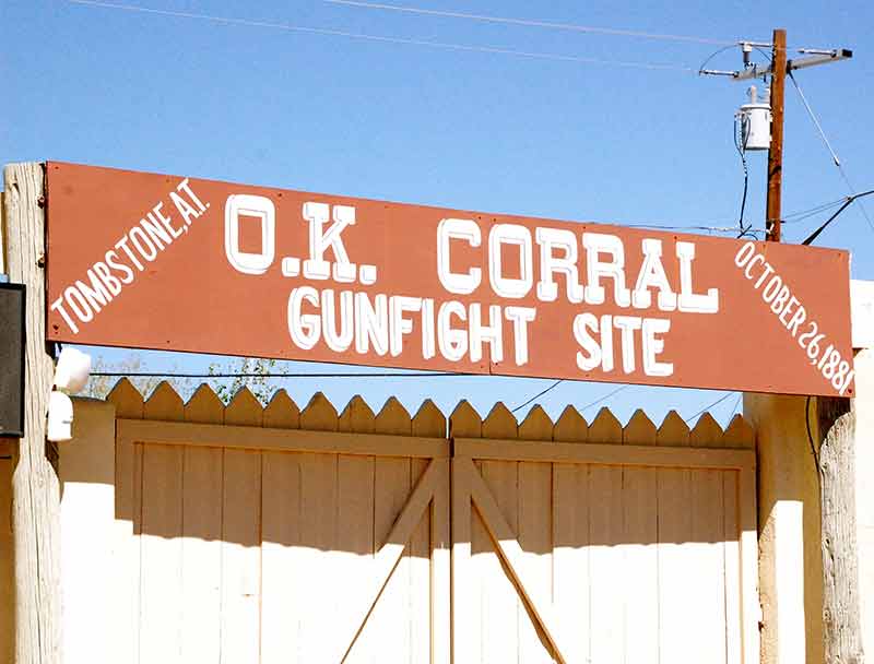 top 10 things to do in tombstone az sign with the words 'OK Corral Gunfight Site'