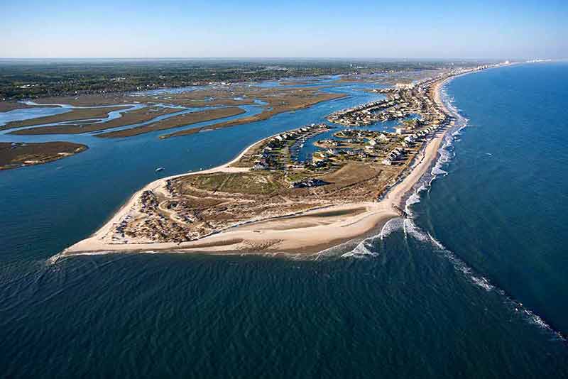 top beaches in south carolina aerial view of peninsula with beach and buildings in Murrells Inlet