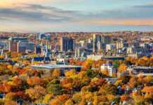 20 Connecticut Cities And Towns Made For A Charming New England Escape distant view of new haven skyline in autumn