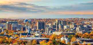 20 Connecticut Cities And Towns Made For A Charming New England Escape distant view of new haven skyline in autumn