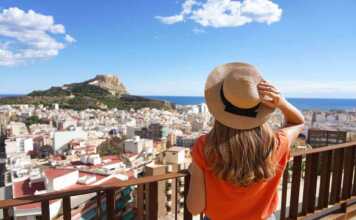 Traveler Girl Enjoying View Of Alicante Cityscape