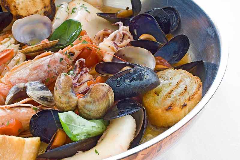 top things to do in atlantic city new jersey Sea food pan of Italian cuisine with mussels, clams, scampi and shrimp.