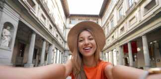 Self Portrait Of Young Tourist Woman In Courtyard Of Historic Uffizi Gallery Art Museum