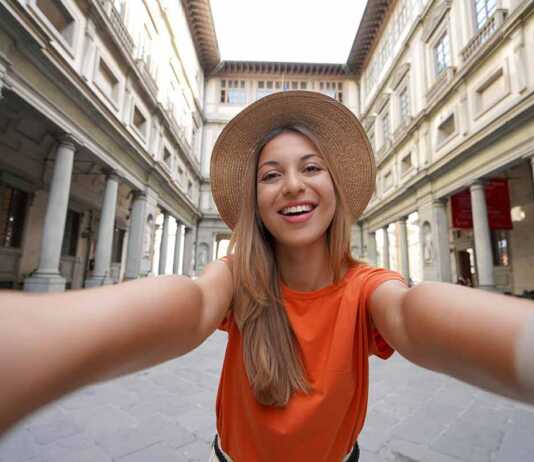 Self Portrait Of Young Tourist Woman In Courtyard Of Historic Uffizi Gallery Art Museum