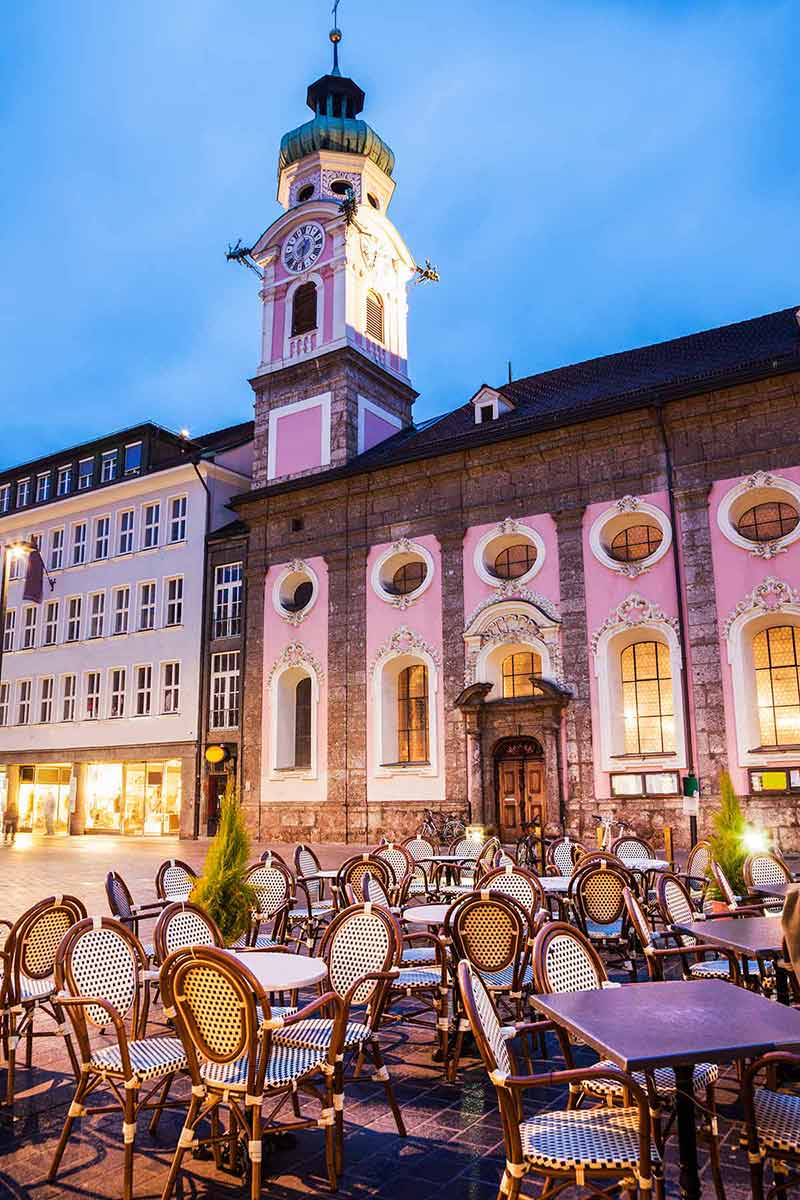 top things to do in innsbruck austria clock tower and cafe in the plaza