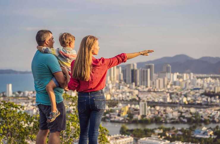 20 Amazing Things To Do In Nha Trang Vietnam Happy family tourists on the background of Nha Trang city. Travel to Vietnam with kids.