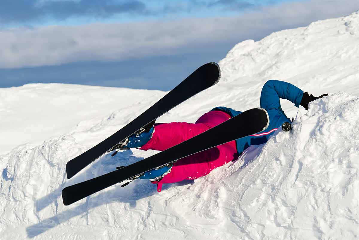 A Woman Fell On Skis From A Mountain In The Snow