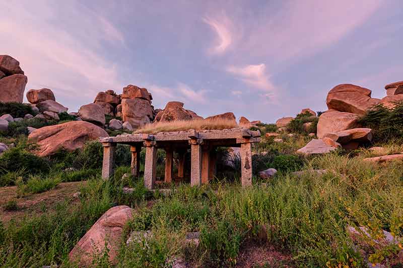 Ancient ruins of Hampi on sunset