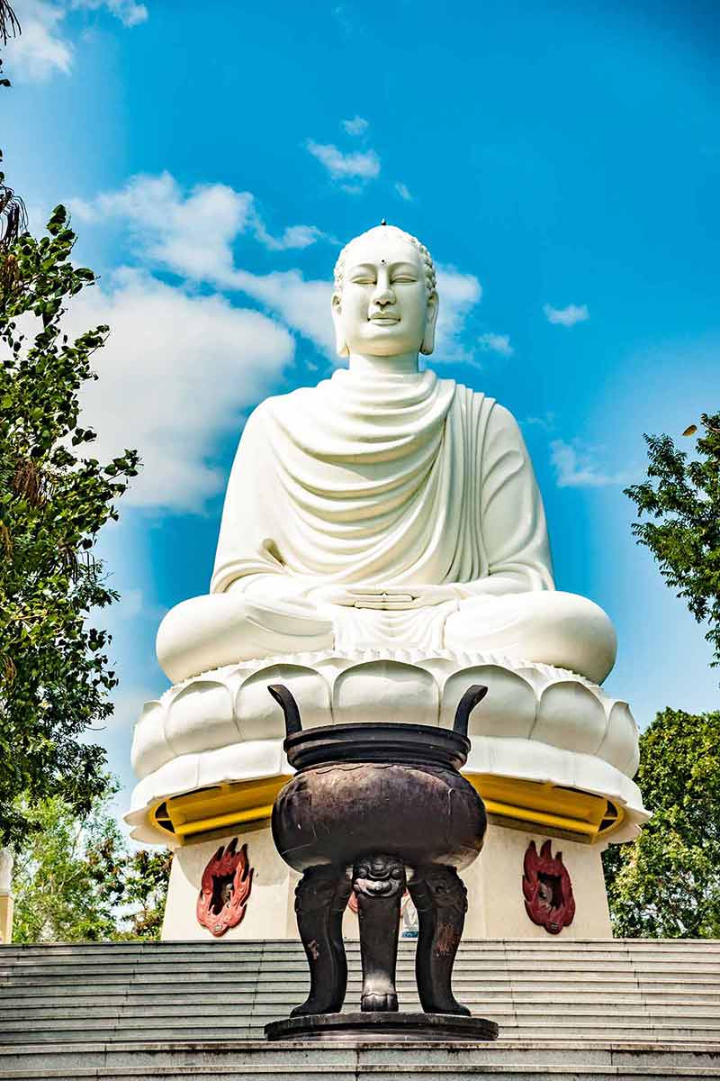 Statue Of The Buddha Against The Blue Sky