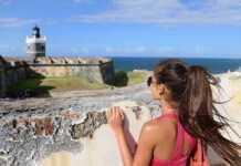 us national parks puerto rico woman in San Juan, looking down at the fort Castillo San Felipe Del Morro