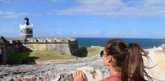 us national parks puerto rico woman in San Juan, looking down at the fort Castillo San Felipe Del Morro