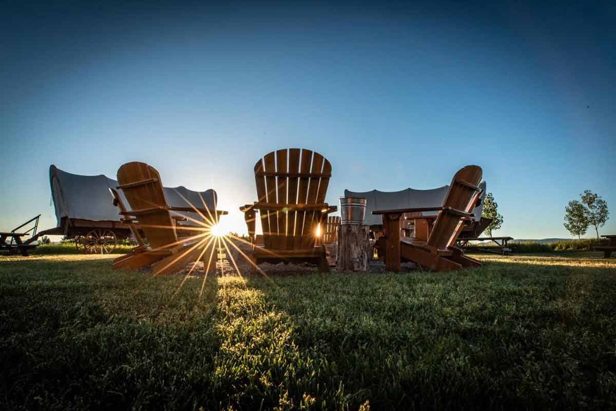 utah glamping Conestoga Ranch deck chairs and wagons