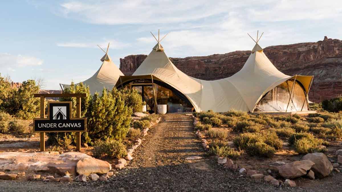 utah glamping tent Under Canvas Moab sign and main tent