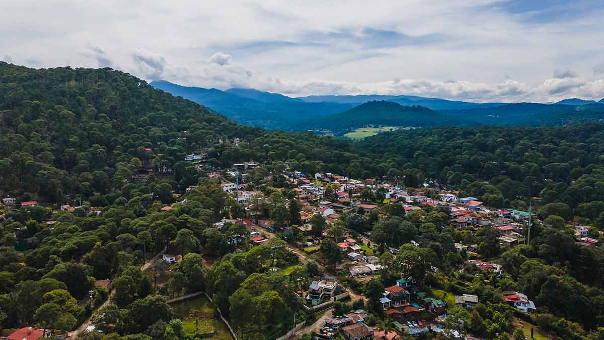valle de bravo rooftops surrounded by green hills and trees
