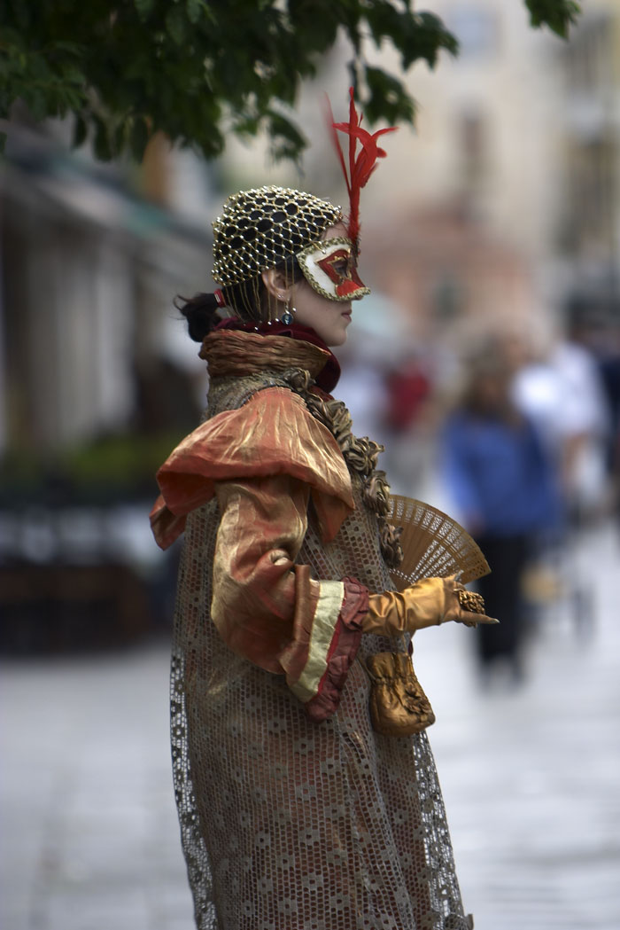 A masked performer in Venice