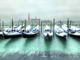 Gondolas In Venice At Cold, Windy Snowy Winter Day