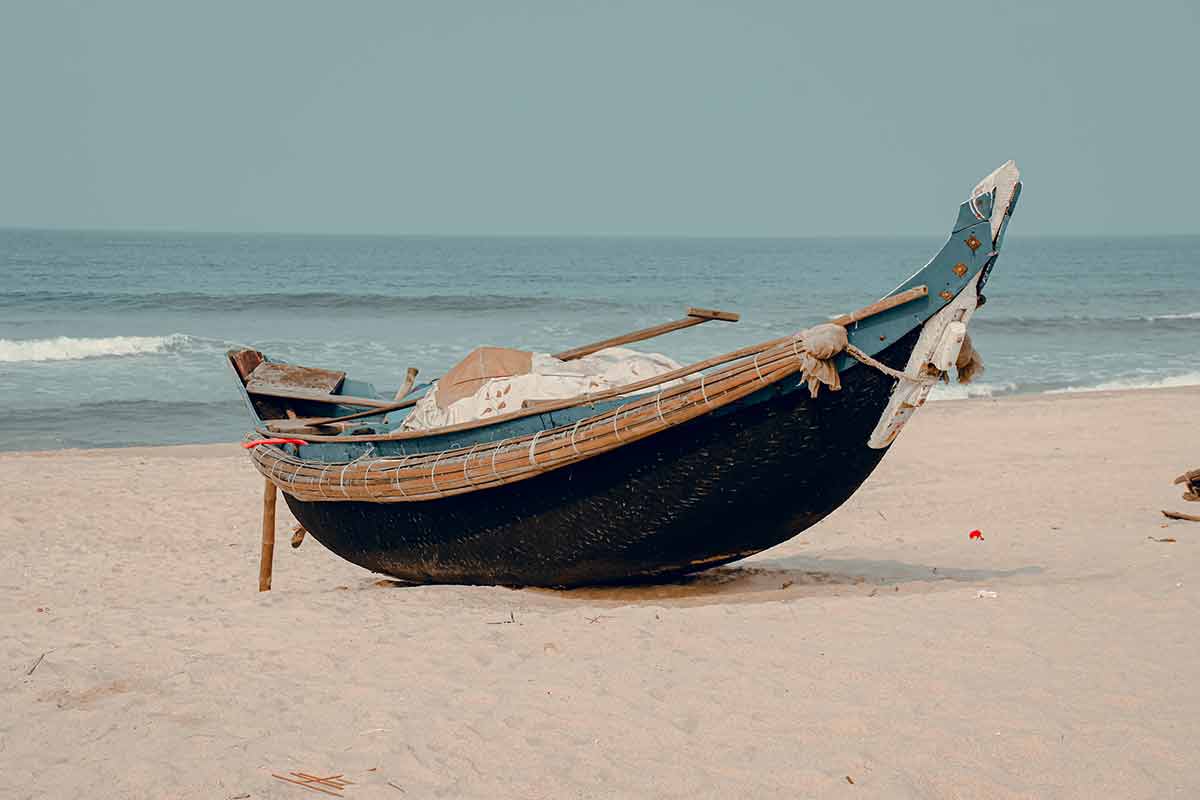vietnam beaches traditional Vietnamese wooden boat