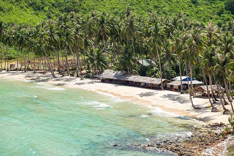 Nam Du Island aerial view of huts and coconut trees