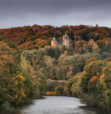 wales castle coch surrounded by autumn forest