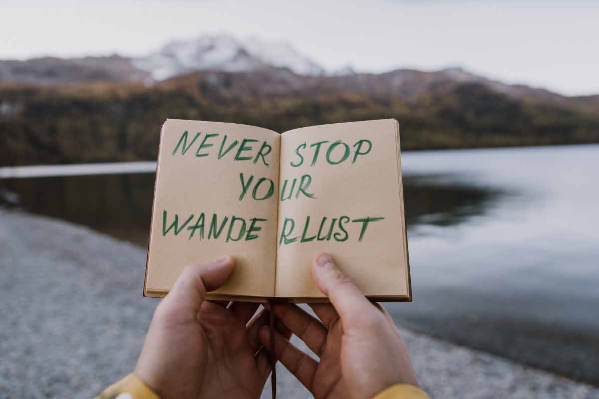 Book with message to never stop your wanderlust