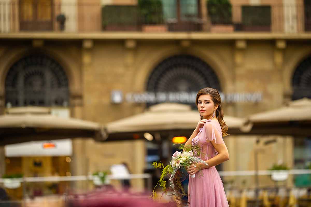 A Bride In A Pink Dress With A Bouquet