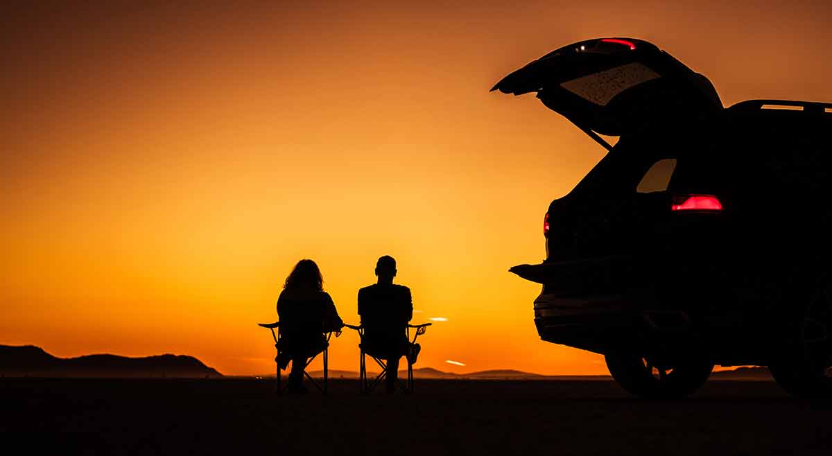 what deserts are in california silhouette of couple sitting and watching the sunset