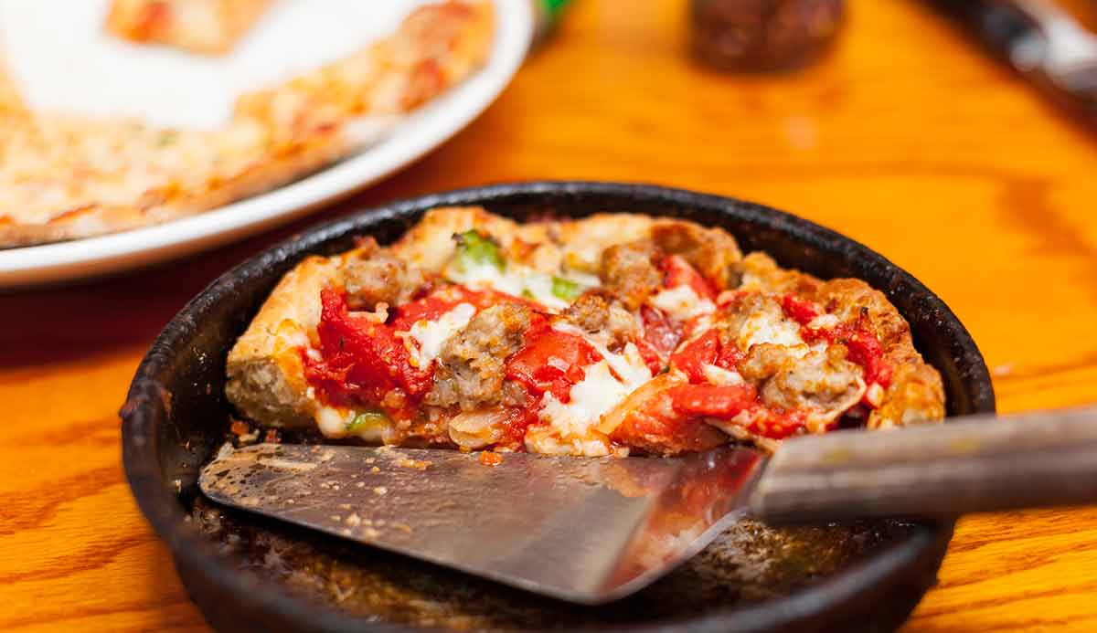 Deep Dish Pizza In Metal Serving Dish