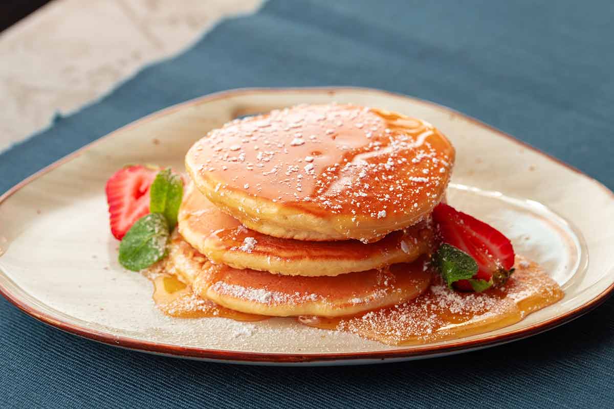 Pancakes With Strawberry And Maple Syrup
