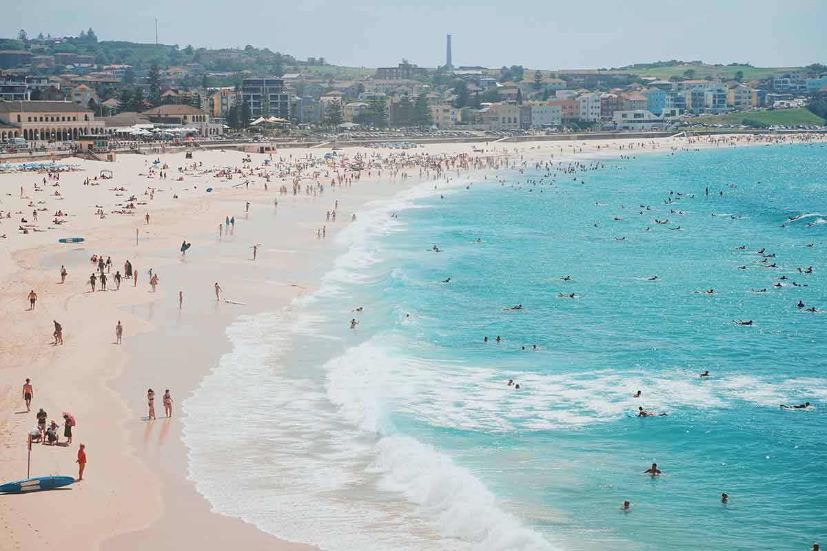 People Relaxing In Summer Vacation On The Bondi Beach