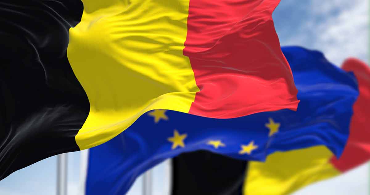 Belgium Waving In The Wind With Blurred European Union Flag