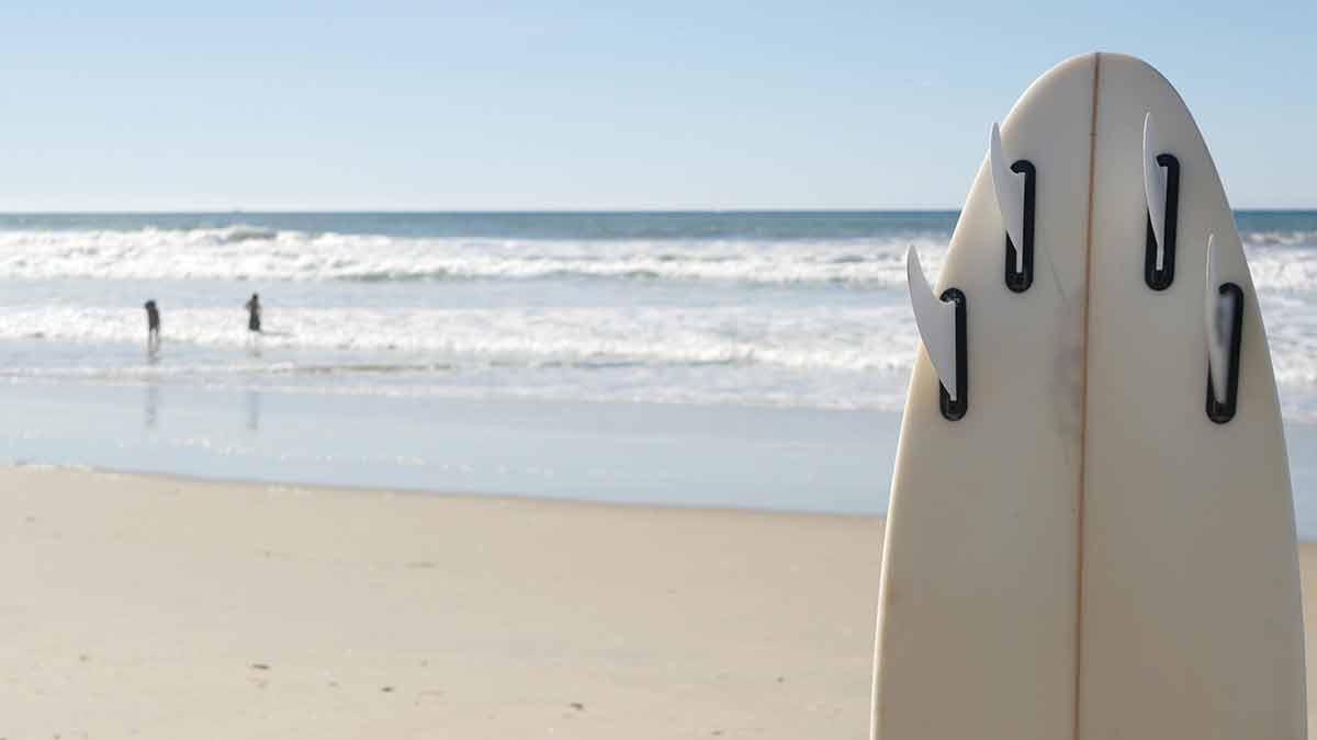 Surfboard For Surfing Standing On Beach Sand