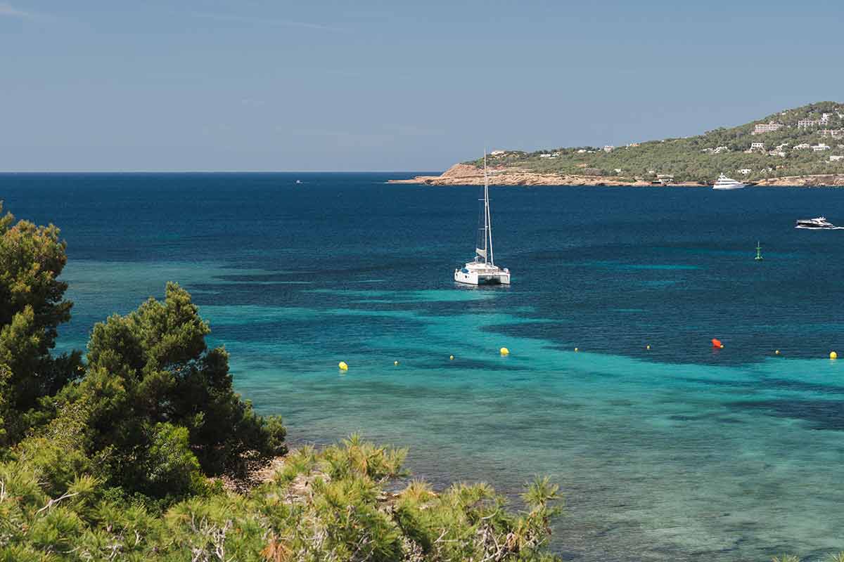 Sailing Yacht Stay In Dream Bay With Turquoise Transparent Water
