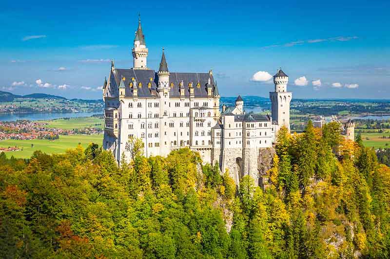 Neuschwanstein Castle At Golden Autumn In Bavarian Alps