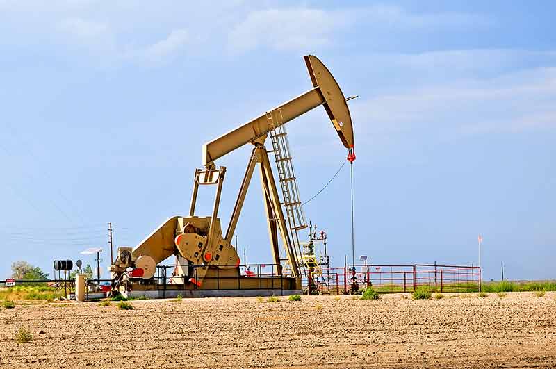 Large Pump Jack Pulling Crude Oil Up
