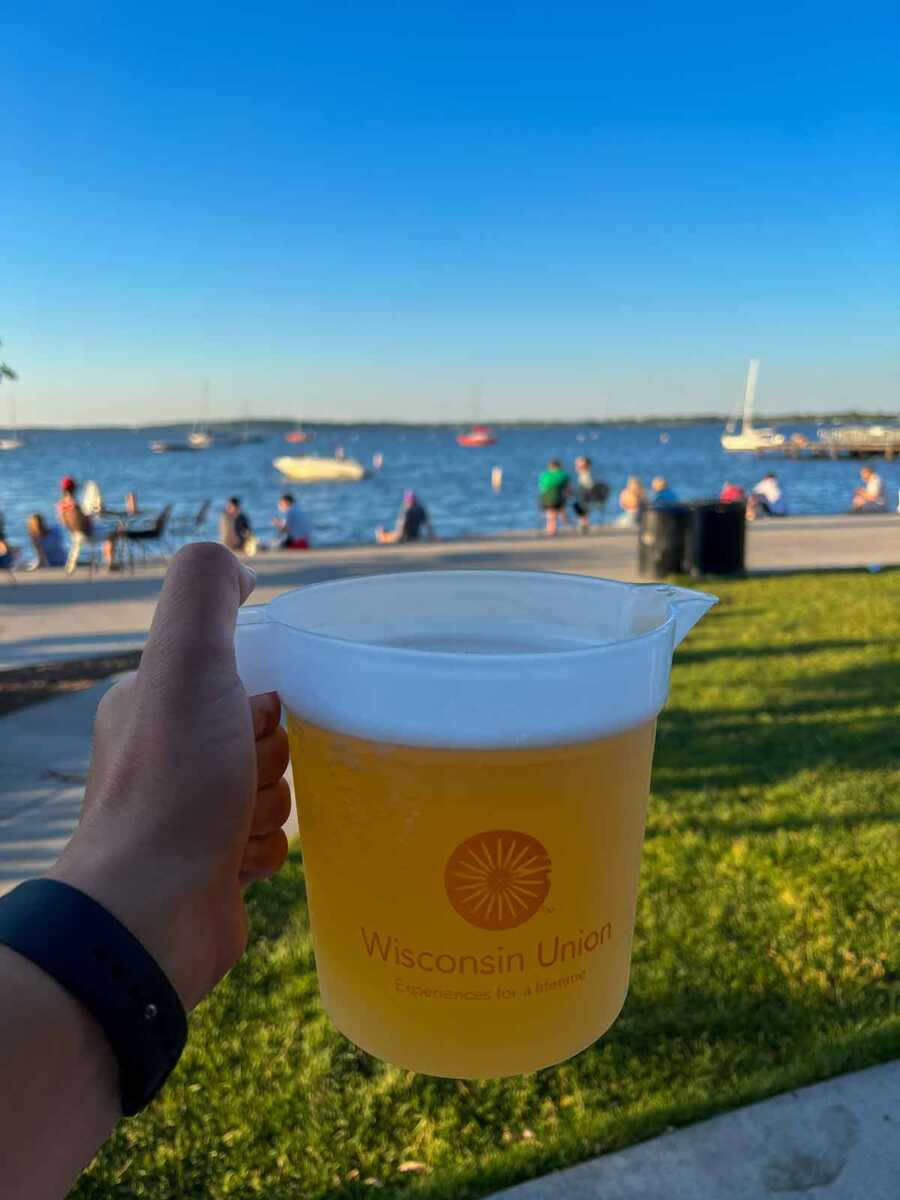 Holding A Jug Of Beer During Summer Sunset At Madison Memorial Union