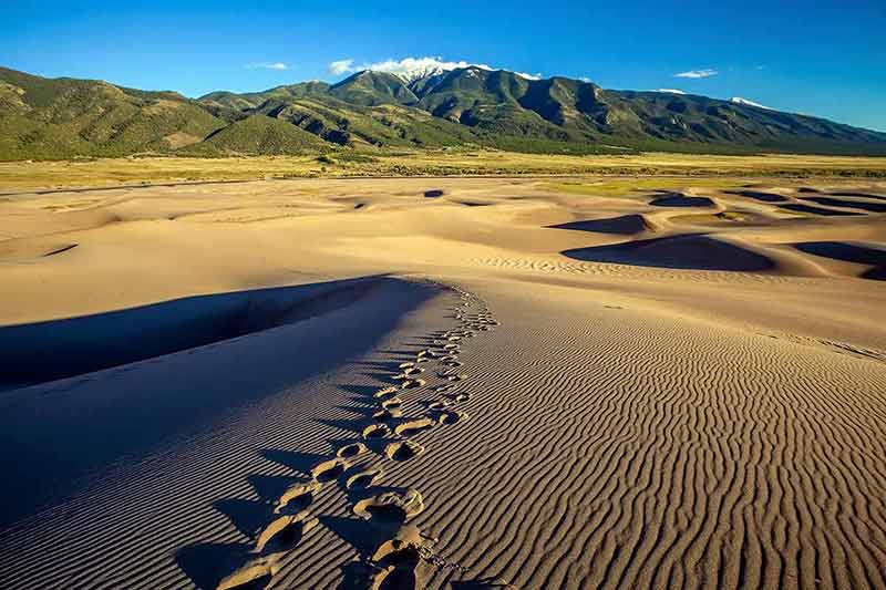 what national parks are in colorado footsteps in the sand dunes