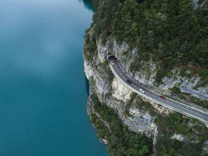 Winding Road And Tunnels Around A Swiss Lake