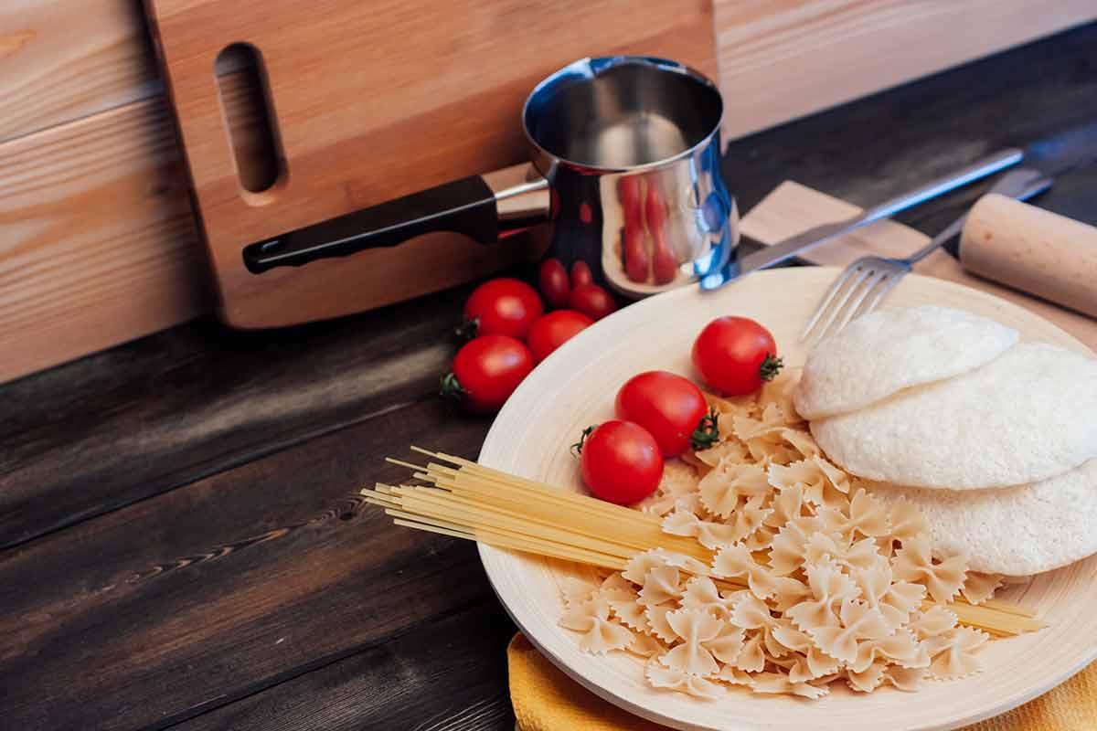 what to do at night in milan Pasta Italian cuisine lunch cooking wooden table.